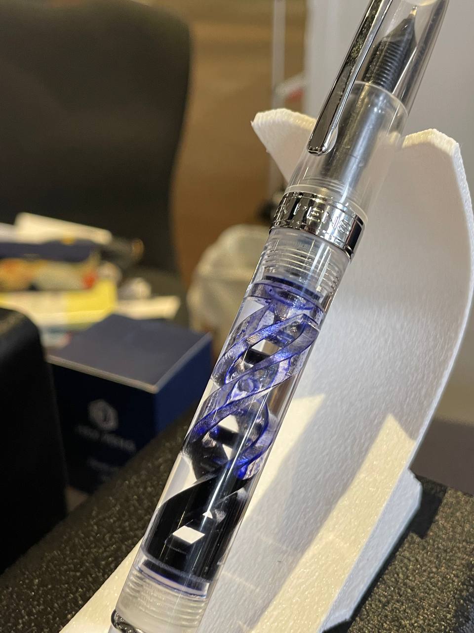 Helix fountain pen company pen with some ink inside the barrel to show off the internal design
